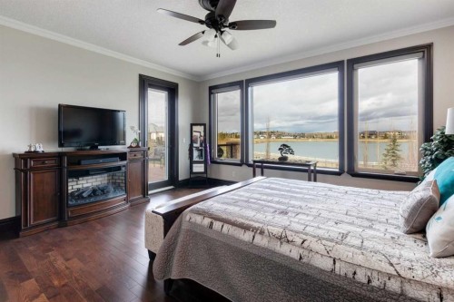 31 Montenaro Bay, Cochrane Lake, AB - Indoor Photo Showing Bedroom