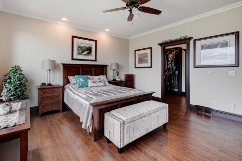 31 Montenaro Bay, Cochrane Lake, AB - Indoor Photo Showing Bedroom