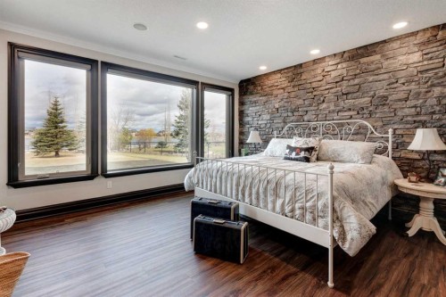 31 Montenaro Bay, Cochrane Lake, AB - Indoor Photo Showing Bedroom