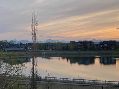 31 Montenaro Bay, Cochrane Lake, AB - Outdoor With Body Of Water With View