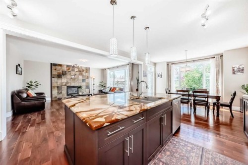 75 Silverado Bank Gardens Sw, Calgary, AB - Indoor Photo Showing Kitchen With Fireplace