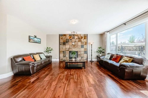 75 Silverado Bank Gardens Sw, Calgary, AB - Indoor Photo Showing Living Room With Fireplace