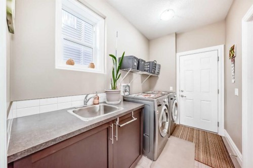 75 Silverado Bank Gardens Sw, Calgary, AB - Indoor Photo Showing Laundry Room