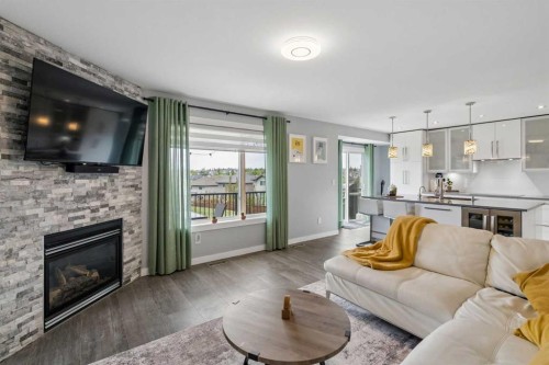 105 Royal Birch Crescent Nw, Calgary, AB - Indoor Photo Showing Living Room With Fireplace