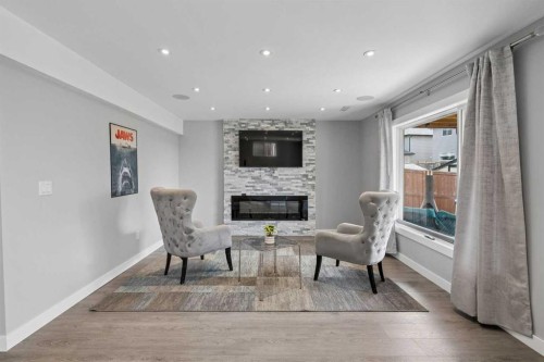 105 Royal Birch Crescent Nw, Calgary, AB - Indoor With Fireplace