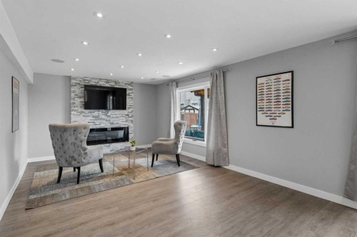 105 Royal Birch Crescent Nw, Calgary, AB - Indoor Photo Showing Living Room With Fireplace