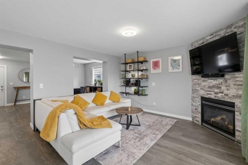 105 Royal Birch Crescent Nw, Calgary, AB - Indoor Photo Showing Living Room With Fireplace