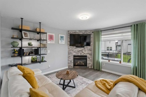 105 Royal Birch Crescent Nw, Calgary, AB - Indoor Photo Showing Living Room With Fireplace