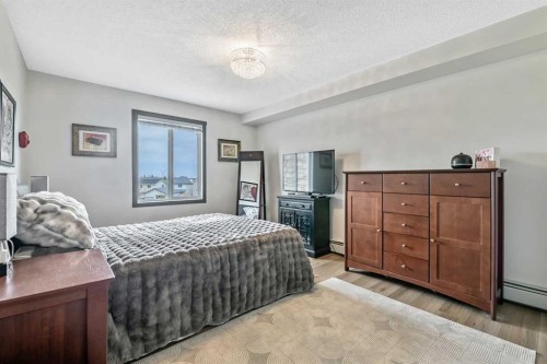 2307-12 Cimarron Common, Okotoks, AB - Indoor Photo Showing Bedroom