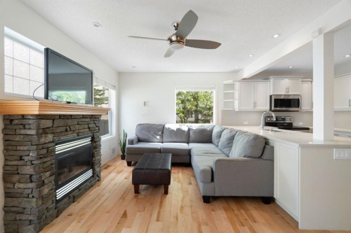 10 Eversyde Court Sw, Calgary, AB - Indoor Photo Showing Living Room With Fireplace