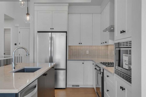 107 Bartlett Row Se, Calgary, AB - Indoor Photo Showing Kitchen With Upgraded Kitchen