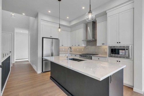 107 Bartlett Row Se, Calgary, AB - Indoor Photo Showing Kitchen With Upgraded Kitchen