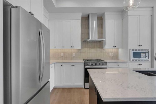 107 Bartlett Row Se, Calgary, AB - Indoor Photo Showing Kitchen With Upgraded Kitchen