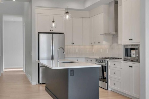 107 Bartlett Row Se, Calgary, AB - Indoor Photo Showing Kitchen With Upgraded Kitchen