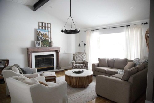 64 Hartford Road Nw, Calgary, AB - Indoor Photo Showing Living Room With Fireplace