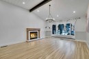 64 Hartford Road Nw, Calgary, AB  - Indoor Photo Showing Living Room With Fireplace 