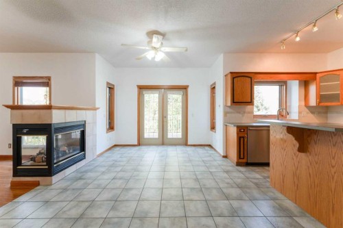 117 Evergreen Place Sw, Calgary, AB - Indoor With Fireplace