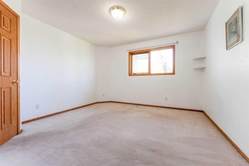 117 Evergreen Place Sw, Calgary, AB - Indoor Photo Showing Other Room
