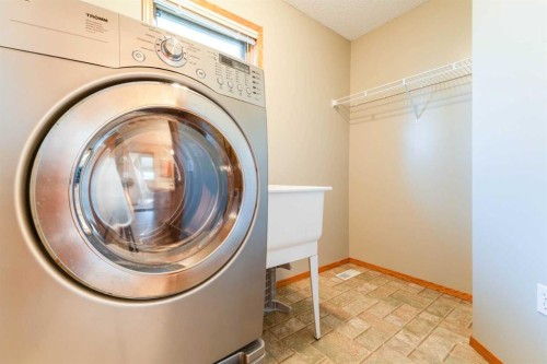 117 Evergreen Place Sw, Calgary, AB - Indoor Photo Showing Laundry Room