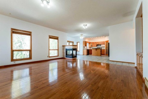 117 Evergreen Place Sw, Calgary, AB - Indoor With Fireplace