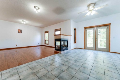 117 Evergreen Place Sw, Calgary, AB - Indoor With Fireplace