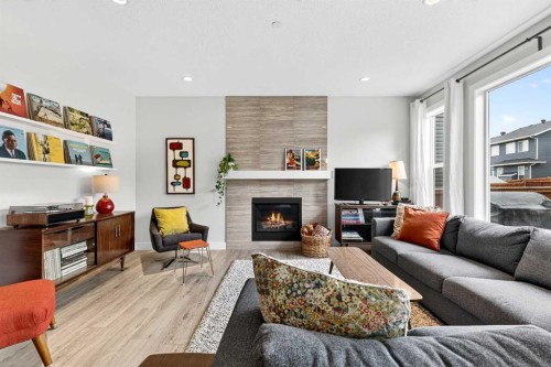 95 Howse Road Ne, Calgary, AB - Indoor Photo Showing Living Room With Fireplace