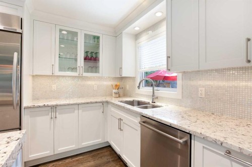 51 Wimbledon Drive Sw, Calgary, AB - Indoor Photo Showing Kitchen With Double Sink With Upgraded Kitchen