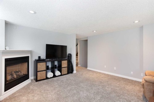 51 Wimbledon Drive Sw, Calgary, AB - Indoor Photo Showing Living Room With Fireplace