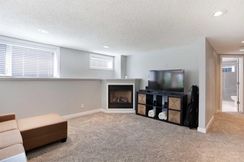 51 Wimbledon Drive Sw, Calgary, AB - Indoor Photo Showing Other Room With Fireplace