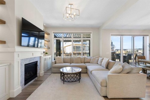 143 Marina Landing Se, Calgary, AB - Indoor Photo Showing Living Room With Fireplace