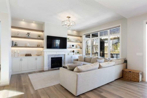 143 Marina Landing Se, Calgary, AB - Indoor Photo Showing Living Room With Fireplace