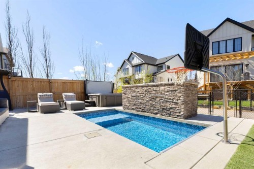 143 Marina Landing Se, Calgary, AB - Outdoor With In Ground Pool With Deck Patio Veranda