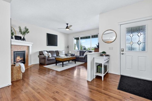 261 Copperstone Terrace Se, Calgary, AB - Indoor Photo Showing Living Room With Fireplace