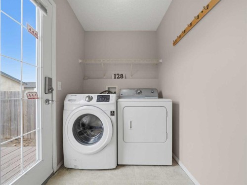 128 Taradale Drive Ne, Calgary, AB - Indoor Photo Showing Laundry Room