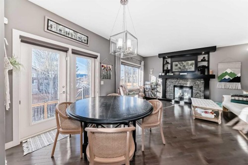 93 Williamstown Green Nw, Airdrie, AB - Indoor Photo Showing Dining Room With Fireplace