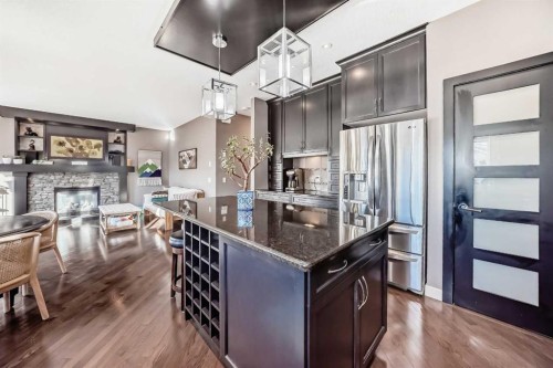 93 Williamstown Green Nw, Airdrie, AB - Indoor Photo Showing Kitchen With Fireplace With Stainless Steel Kitchen With Upgraded Kitchen