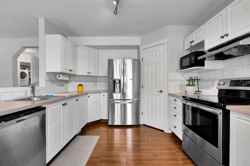 60 Arbour Crest Terrace Nw, Calgary, AB - Indoor Photo Showing Kitchen With Stainless Steel Kitchen With Double Sink