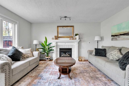 60 Arbour Crest Terrace Nw, Calgary, AB - Indoor Photo Showing Living Room With Fireplace