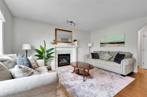 60 Arbour Crest Terrace Nw, Calgary, AB - Indoor Photo Showing Living Room With Fireplace