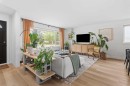 240 Lynnview Way Se, Calgary, AB  - Indoor Photo Showing Living Room 