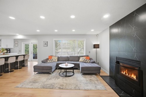 158 Shawbrooke Green Sw, Calgary, AB - Indoor Photo Showing Living Room With Fireplace