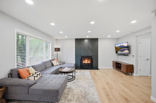 158 Shawbrooke Green Sw, Calgary, AB - Indoor Photo Showing Living Room With Fireplace