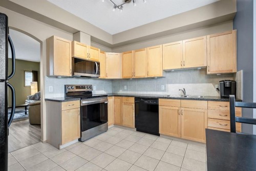209 Strathcona Circle, Strathmore, AB - Indoor Photo Showing Kitchen With Double Sink