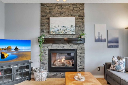 104 Prestwick Street Se, Calgary, AB - Indoor Photo Showing Living Room With Fireplace