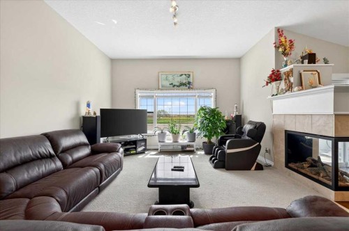248 Rainbow Falls Way, Chestermere, AB - Indoor Photo Showing Living Room With Fireplace