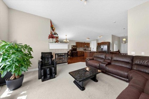 248 Rainbow Falls Way, Chestermere, AB - Indoor Photo Showing Living Room With Fireplace