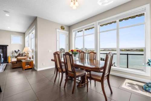54 Auburn Sound Place Se, Calgary, AB - Indoor Photo Showing Dining Room With Fireplace