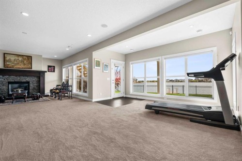 54 Auburn Sound Place Se, Calgary, AB - Indoor With Fireplace