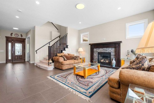 54 Auburn Sound Place Se, Calgary, AB - Indoor Photo Showing Living Room With Fireplace