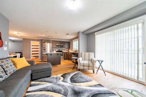 4318-99 Copperstone Park Se, Calgary, AB - Indoor Photo Showing Living Room